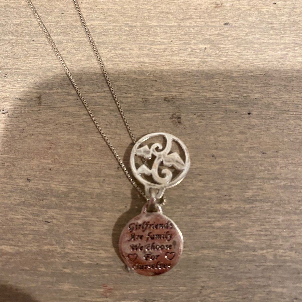 sterling silver friendship necklace,has a little tree with hearts around it